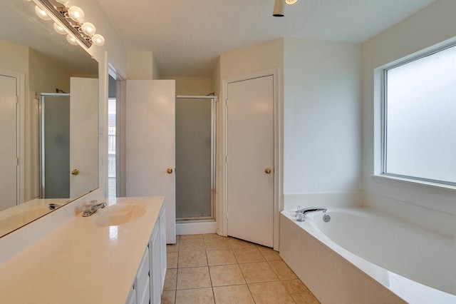 307 Apache Trl, Alvarado, TX 76009 - bathroom with a stall shower, vanity, tile patterned flooring, and a bath