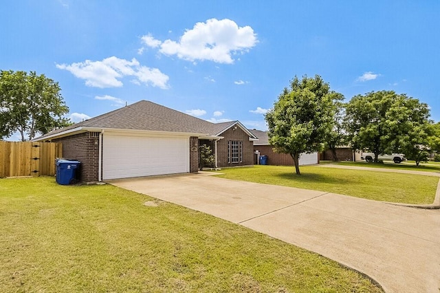 307 Apache Trl, Alvarado, TX 76009 - view of front of house featuring brick siding, a garage, driveway, and roof with shingles
