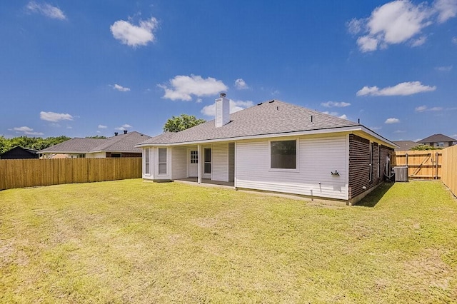 307 Apache Trl, Alvarado, TX 76009 - back of house featuring central AC, a chimney, and roof with shingles