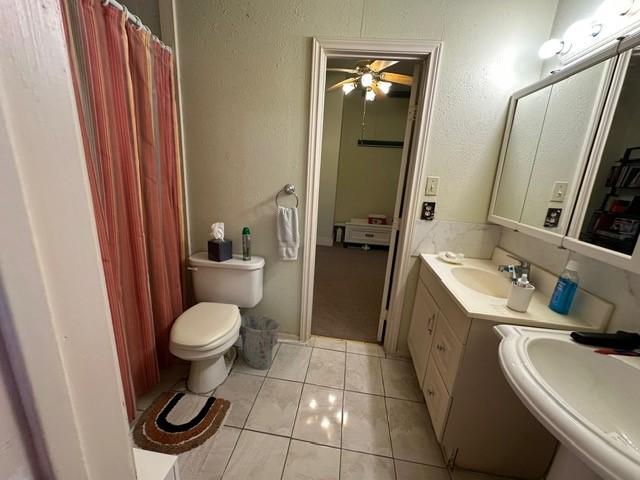 301 Dogwood Ave, Princeton, TX 75407 - full bathroom with toilet, tile patterned flooring, ceiling fan, and double vanity