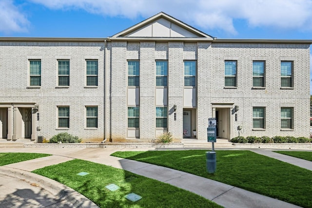 1946 Bel Air Dr, Arlington, TX 76010 - townhome / multi-family property with a front lawn and brick siding