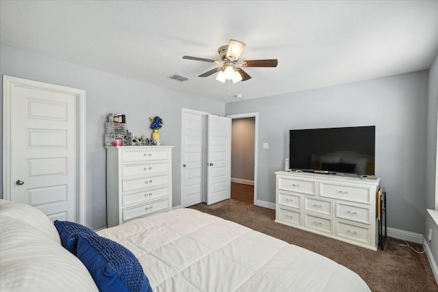 1946 Bel Air Dr, Arlington, TX 76010 - bedroom with dark colored carpet, baseboards, and ceiling fan