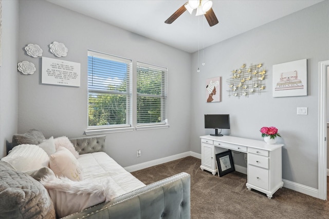 1946 Bel Air Dr, Arlington, TX 76010 - bedroom featuring dark carpet, baseboards, an office area, and a ceiling fan