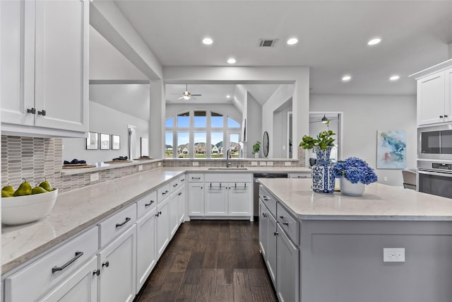 1128 Lake Hills Trl, Roanoke, TX 76262 - kitchen with a ceiling fan, appliances with stainless steel finishes, light stone counters, backsplash, and recessed lighting