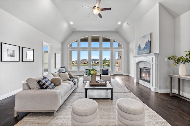 1128 Lake Hills Trl, Roanoke, TX 76262 - living area with ceiling fan, a glass covered fireplace, baseboards, high vaulted ceiling, and dark wood finished floors