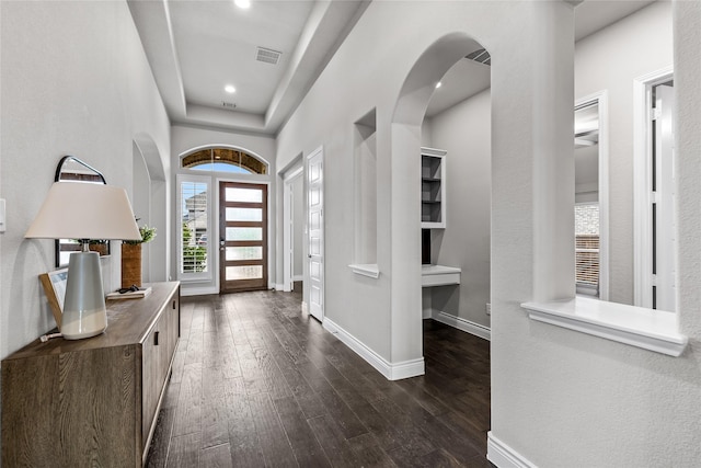 1128 Lake Hills Trl, Roanoke, TX 76262 - entrance foyer with healthy amount of natural light, dark wood finished floors, baseboards, arched walkways, and recessed lighting