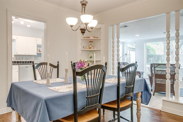 4016 El Campo Ave, Fort Worth, TX 76107 - dining space with light wood finished floors, ornamental molding, and a chandelier