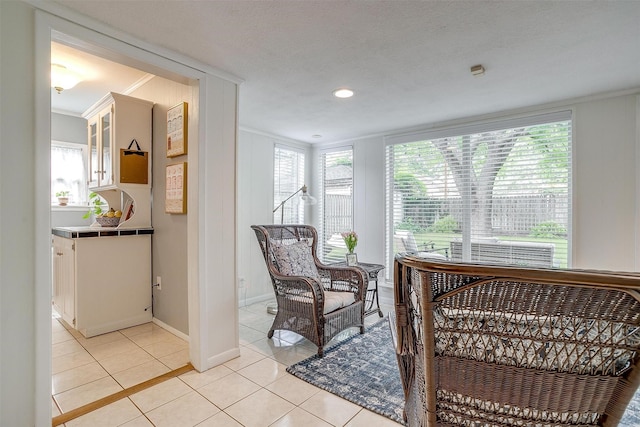 4016 El Campo Ave, Fort Worth, TX 76107 - living area featuring ornamental molding, light tile patterned flooring, and baseboards