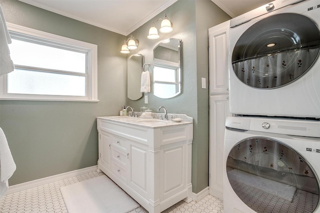 4016 El Campo Ave, Fort Worth, TX 76107 - full bath featuring estacked washer and dryer, ornamental molding, double vanity, baseboards, and a shower with curtain