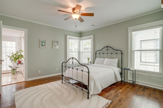 4016 El Campo Ave, Fort Worth, TX 76107 - bedroom featuring multiple windows, dark wood-style floors, baseboards, crown molding, and a ceiling fan