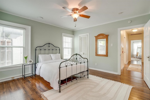 4016 El Campo Ave, Fort Worth, TX 76107 - bedroom with multiple windows, wood finished floors, ornamental molding, baseboards, and ceiling fan