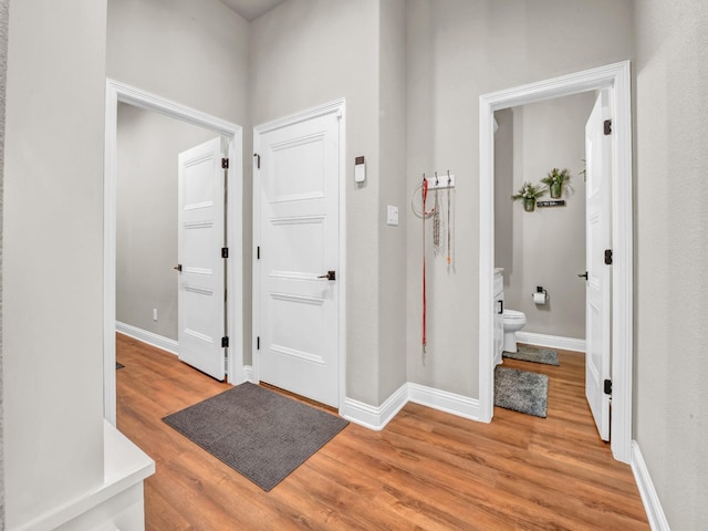 221 Greene Rd, Weatherford, TX 76087 - hallway with light wood-type flooring and baseboards