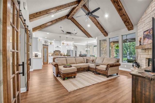 221 Greene Rd, Weatherford, TX 76087 - living room with a ceiling fan, beamed ceiling, light wood-style floors, a fireplace, and recessed lighting