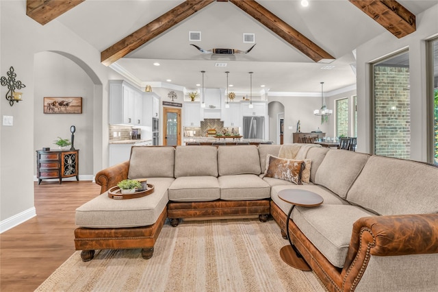 221 Greene Rd, Weatherford, TX 76087 - living room featuring arched walkways, light wood-type flooring, a chandelier, recessed lighting, and baseboards