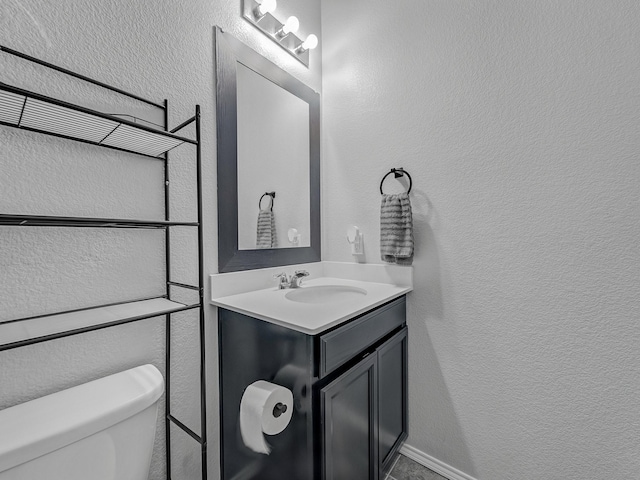 905 Jonius Creek Dr, Little Elm, TX 75068 - half bathroom with vanity, toilet, and a textured wall