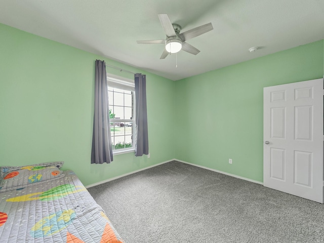 905 Jonius Creek Dr, Little Elm, TX 75068 - unfurnished bedroom with carpet flooring, baseboards, and ceiling fan