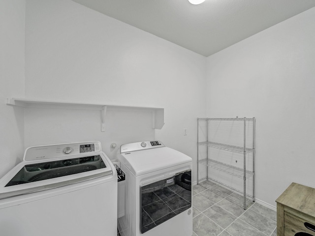 905 Jonius Creek Dr, Little Elm, TX 75068 - laundry room with washing machine and clothes dryer and baseboards