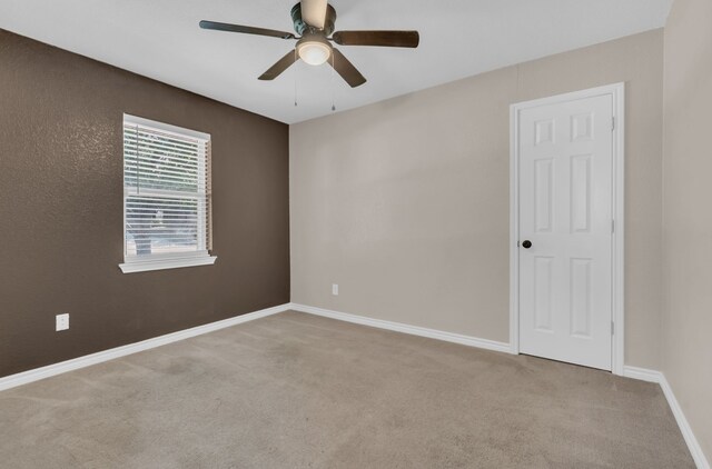 1507 Linda St, Bowie, TX 76230 - carpeted empty room with ceiling fan and baseboards