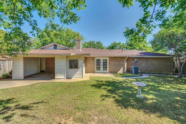 1507 Linda St, Bowie, TX 76230 - ranch-style home featuring french doors, cooling unit, a chimney, a patio, and brick siding