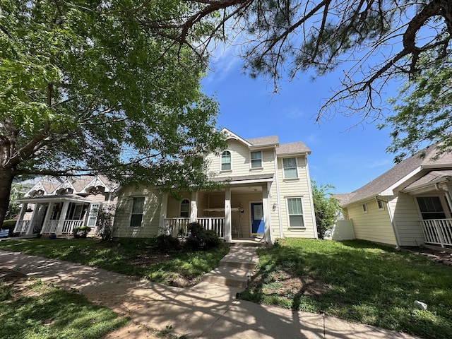 1026 Elm Dr, Providence Village, TX 76227 - traditional home with covered porch and a front yard