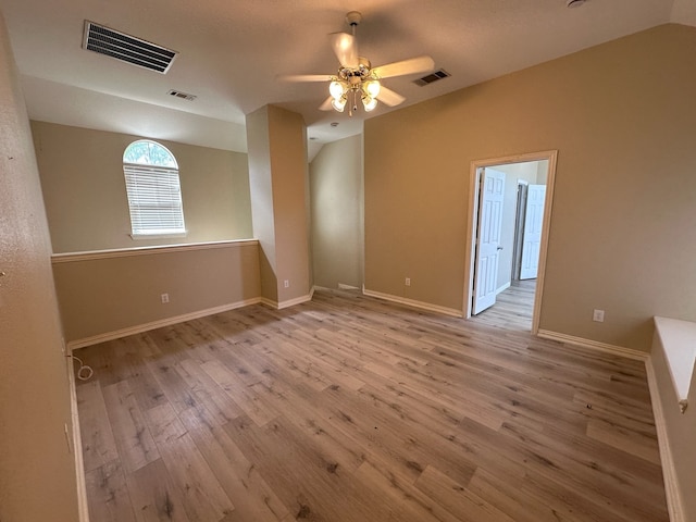 1026 Elm Dr, Providence Village, TX 76227 - spare room featuring vaulted ceiling, wood finished floors, a ceiling fan, and baseboards