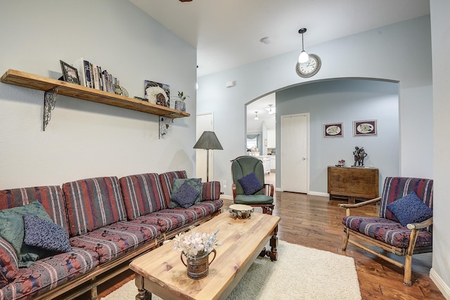 620 Cypress Hill Dr, Mckinney, TX 75071 - living area with arched walkways, wood finished floors, and baseboards