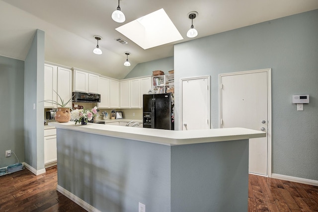 620 Cypress Hill Dr, Mckinney, TX 75071 - kitchen with black refrigerator with ice dispenser, a skylight, light countertops, dark wood-type flooring, and lofted ceiling