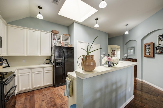 620 Cypress Hill Dr, Mckinney, TX 75071 - kitchen with black appliances, a skylight, hardwood / wood-style floors, white cabinets, and lofted ceiling