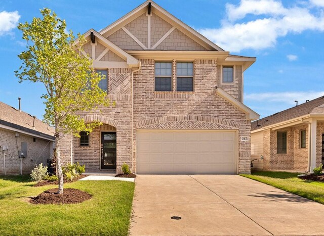 317 Boston Dr, Princeton, TX 74507 - view of front of property featuring driveway, brick siding, an attached garage, and a front yard