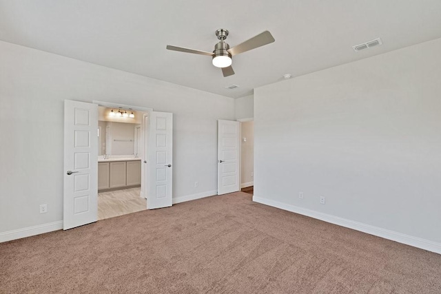 317 Boston Dr, Princeton, TX 74507 - unfurnished bedroom with light carpet, baseboards, ensuite bath, and ceiling fan