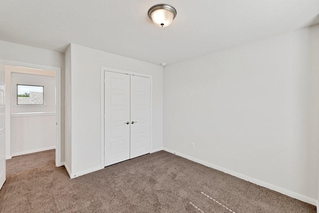 317 Boston Dr, Princeton, TX 74507 - unfurnished bedroom featuring carpet floors, a closet, and baseboards
