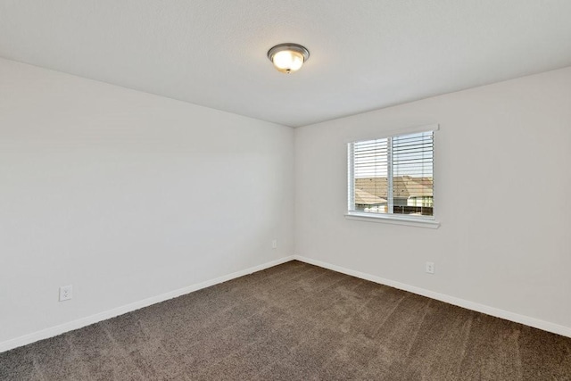 317 Boston Dr, Princeton, TX 74507 - spare room with dark carpet and baseboards