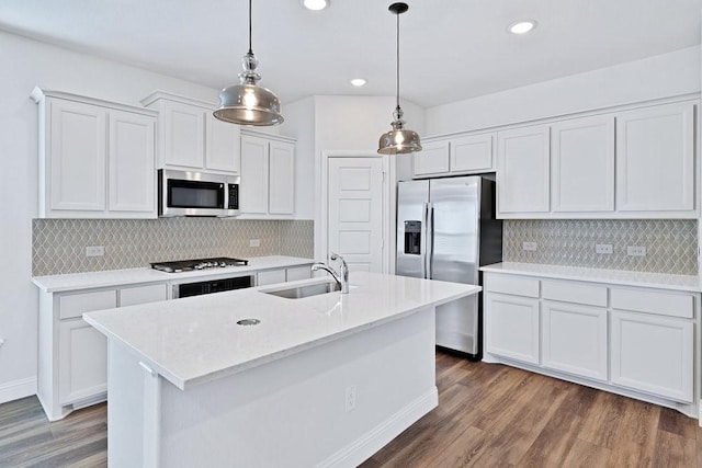317 Boston Dr, Princeton, TX 74507 - kitchen featuring appliances with stainless steel finishes, a sink, white cabinetry, wood finished floors, and backsplash