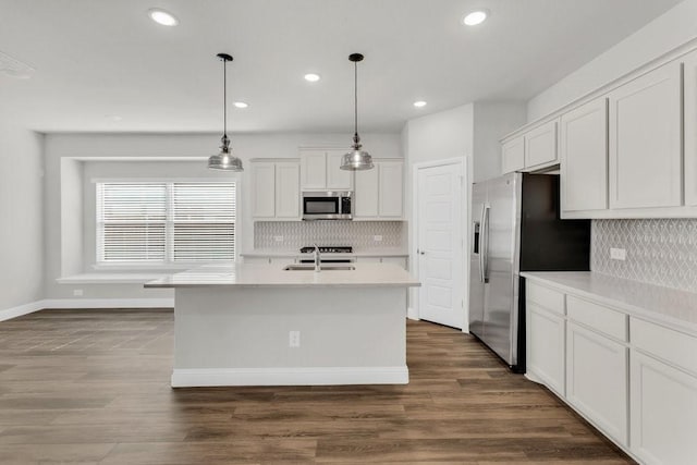 317 Boston Dr, Princeton, TX 74507 - kitchen with stainless steel appliances, a sink, white cabinets, recessed lighting, and tasteful backsplash