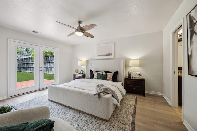 8803 Daytonia Ave, Dallas, TX 75218 - bedroom with french doors, access to outside, light wood-style floors, baseboards, and ceiling fan