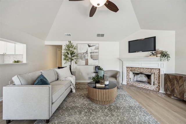 8803 Daytonia Ave, Dallas, TX 75218 - living area with lofted ceiling, wood finished floors, ceiling fan, and a high end fireplace