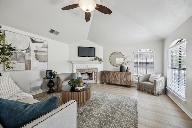 8803 Daytonia Ave, Dallas, TX 75218 - living room featuring vaulted ceiling, light wood-type flooring, ceiling fan, and healthy amount of natural light