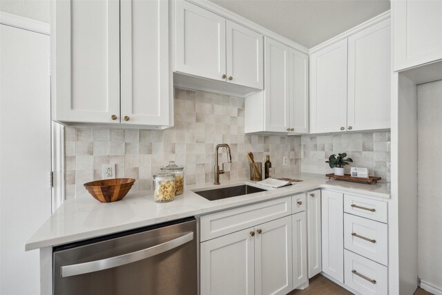 8803 Daytonia Ave, Dallas, TX 75218 - kitchen with dishwasher, a sink, decorative backsplash, and white cabinetry