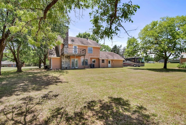 67 Melrose Cir, Denison, TX 75020 - rear view of property featuring a lawn, a balcony, and a chimney