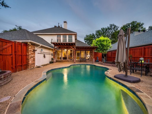 view of swimming pool featuring a pergola, a fenced backyard, and a patio area