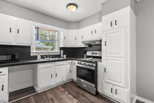 1709 Irving Lee St, Waco, TX 76711 - kitchen with stainless steel gas range oven, black microwave, under cabinet range hood, a sink, and dark countertops