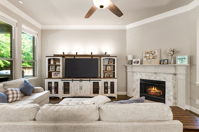 1417 Shenandoah Dr, Mckinney, TX 75071 - living room featuring crown molding, ceiling fan, a premium fireplace, and dark wood-type flooring