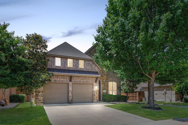 1417 Shenandoah Dr, Mckinney, TX 75071 - view of front of property with stone siding, driveway, a garage, and roof with shingles