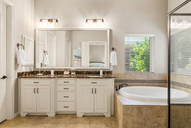 1417 Shenandoah Dr, Mckinney, TX 75071 - bathroom with a bath, double vanity, and tile patterned flooring