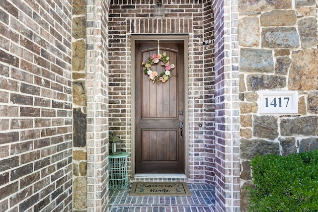 1417 Shenandoah Dr, Mckinney, TX 75071 - view of exterior entry with brick siding