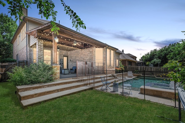 1417 Shenandoah Dr, Mckinney, TX 75071 - pool at dusk featuring ceiling fan, a fenced backyard, and a patio area