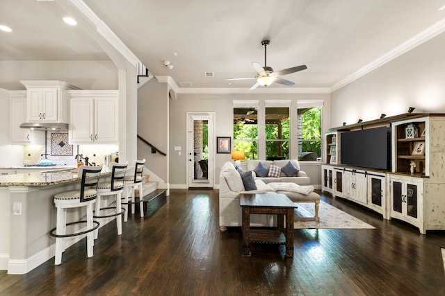 1417 Shenandoah Dr, Mckinney, TX 75071 - living room with dark wood-style floors, ceiling fan, stairway, crown molding, and recessed lighting
