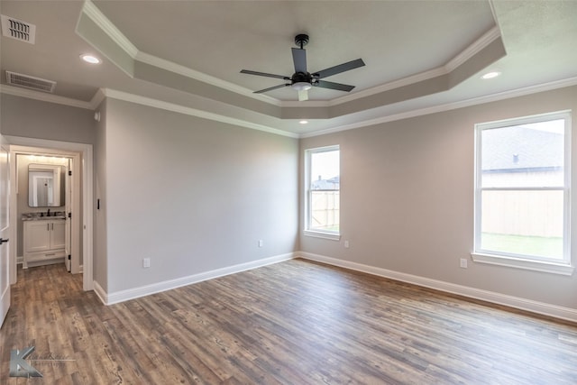 6718 Windmill Grass Ln, Abilene, TX 79606 - spare room featuring a tray ceiling, a ceiling fan, crown molding, wood finished floors, and recessed lighting