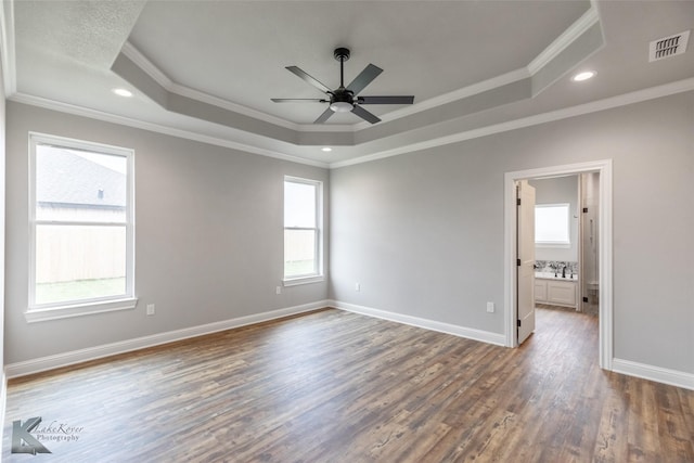 6718 Windmill Grass Ln, Abilene, TX 79606 - unfurnished room with a raised ceiling, crown molding, wood finished floors, ceiling fan, and baseboards