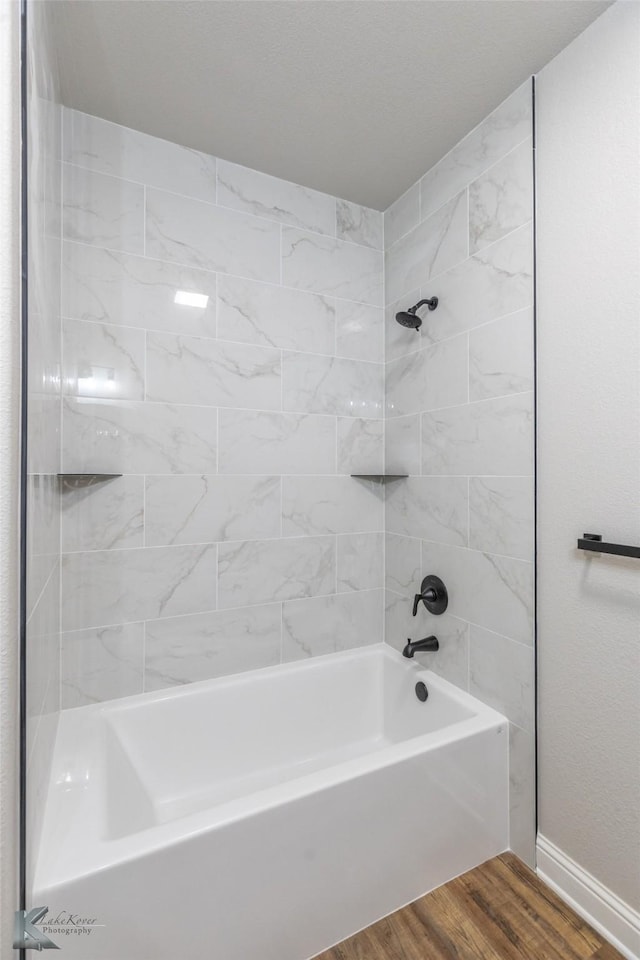 6718 Windmill Grass Ln, Abilene, TX 79606 - full bathroom featuring shower / tub combination, wood finished floors, and baseboards